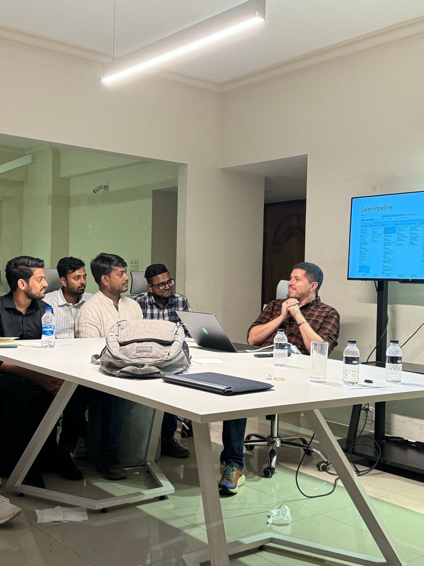 Isaiah McPeak leading a product team session at the Green Pants Studio office in Dhaka, Bangladesh